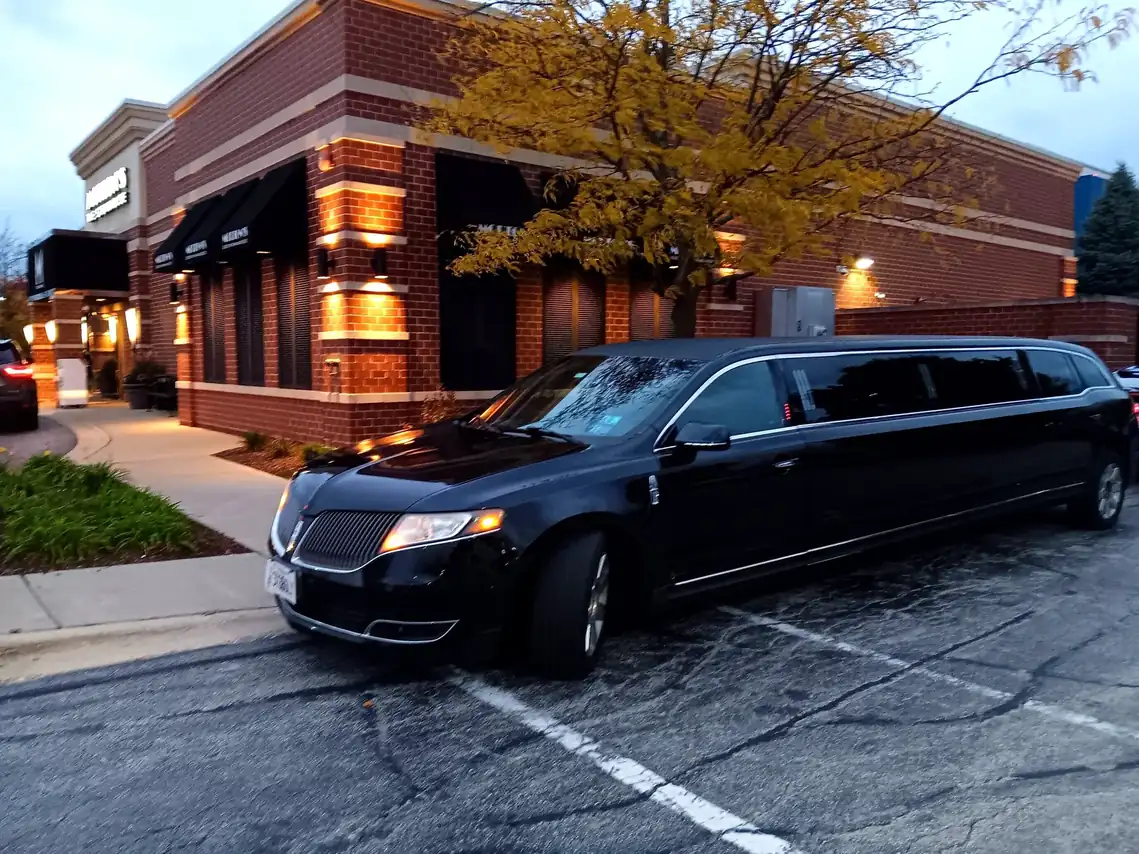 White stretch limousine decorated for Chicago wedding